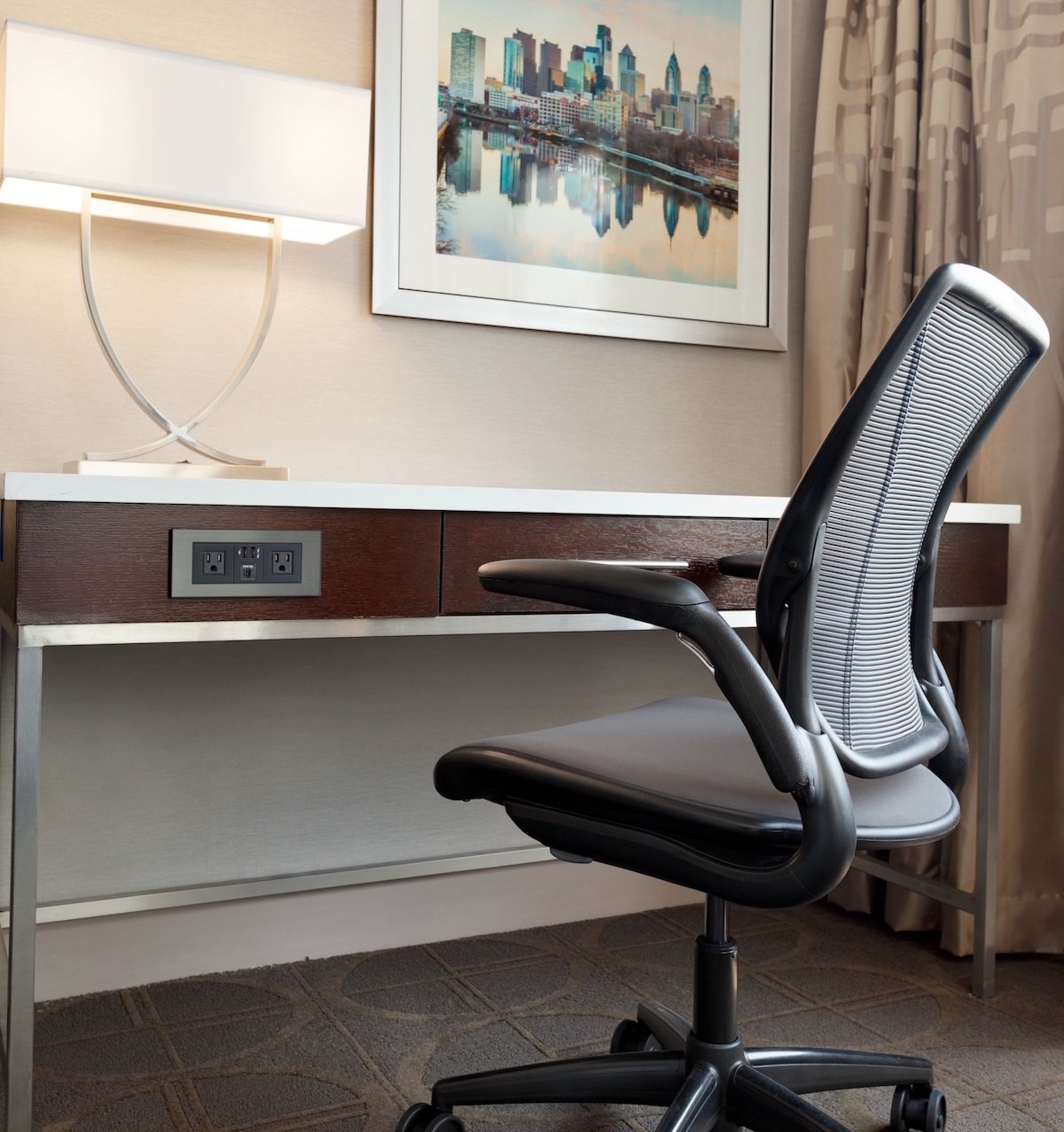 Day-use rooms include a spacious desk, ergonomic chair, and enhanced WiFi